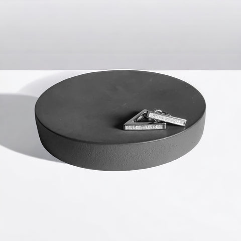 a couple of pieces of metal sitting on top of a table