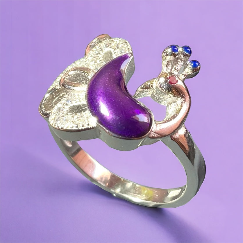 a close up of a ring on a purple background