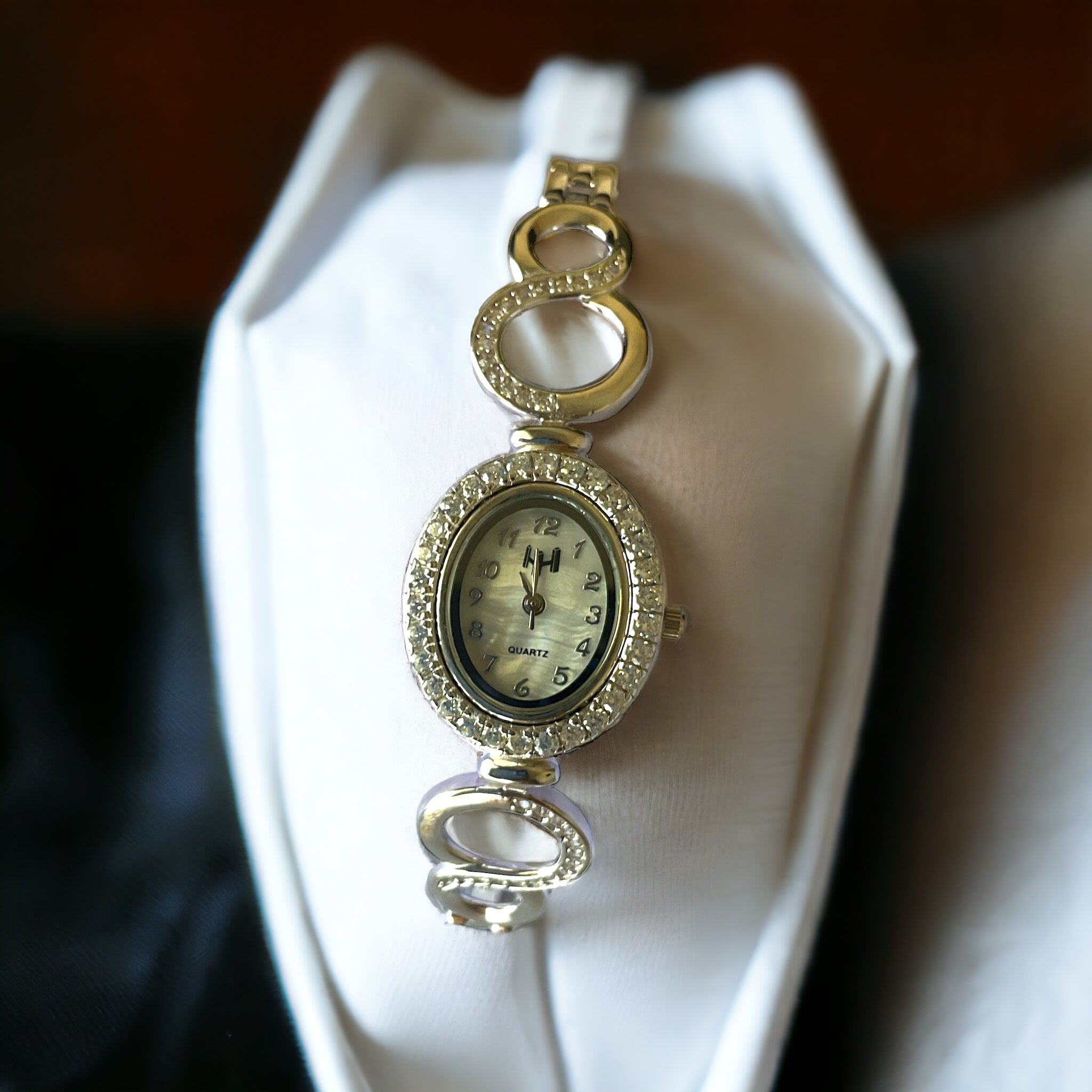 a close up of a watch on a tie