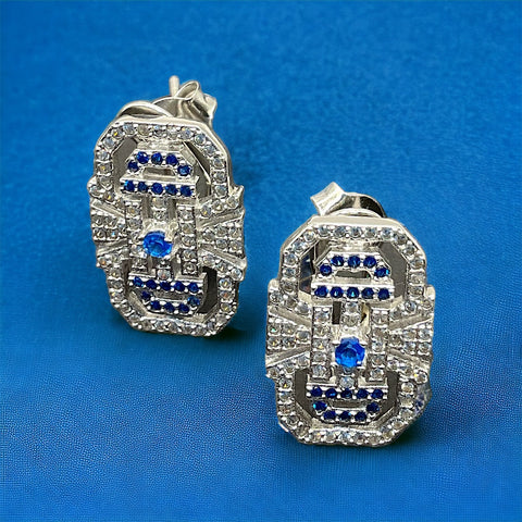 a pair of diamond and sapphire earrings