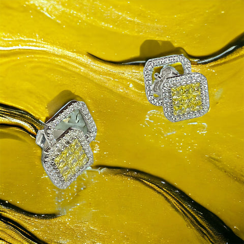 a close up of a pair of diamond earrings