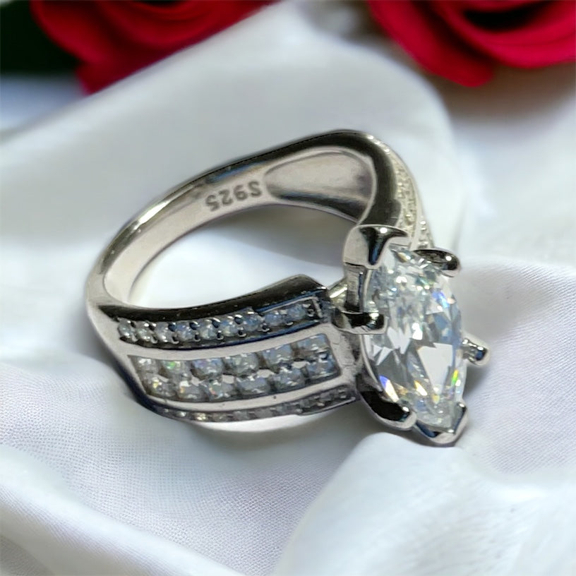 a close up of a ring on a white cloth