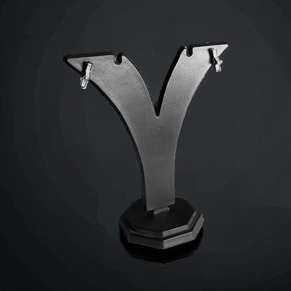 a black and silver object on a black background