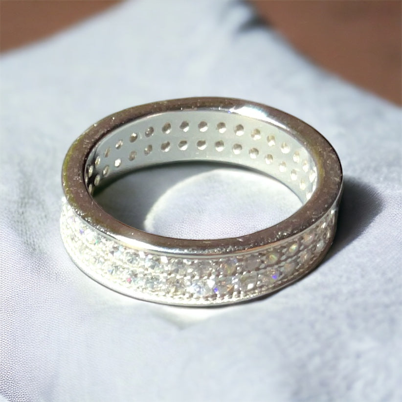 a silver ring with a lot of sparkles on it