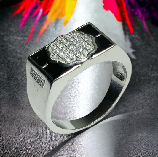 a silver ring with a flower on it