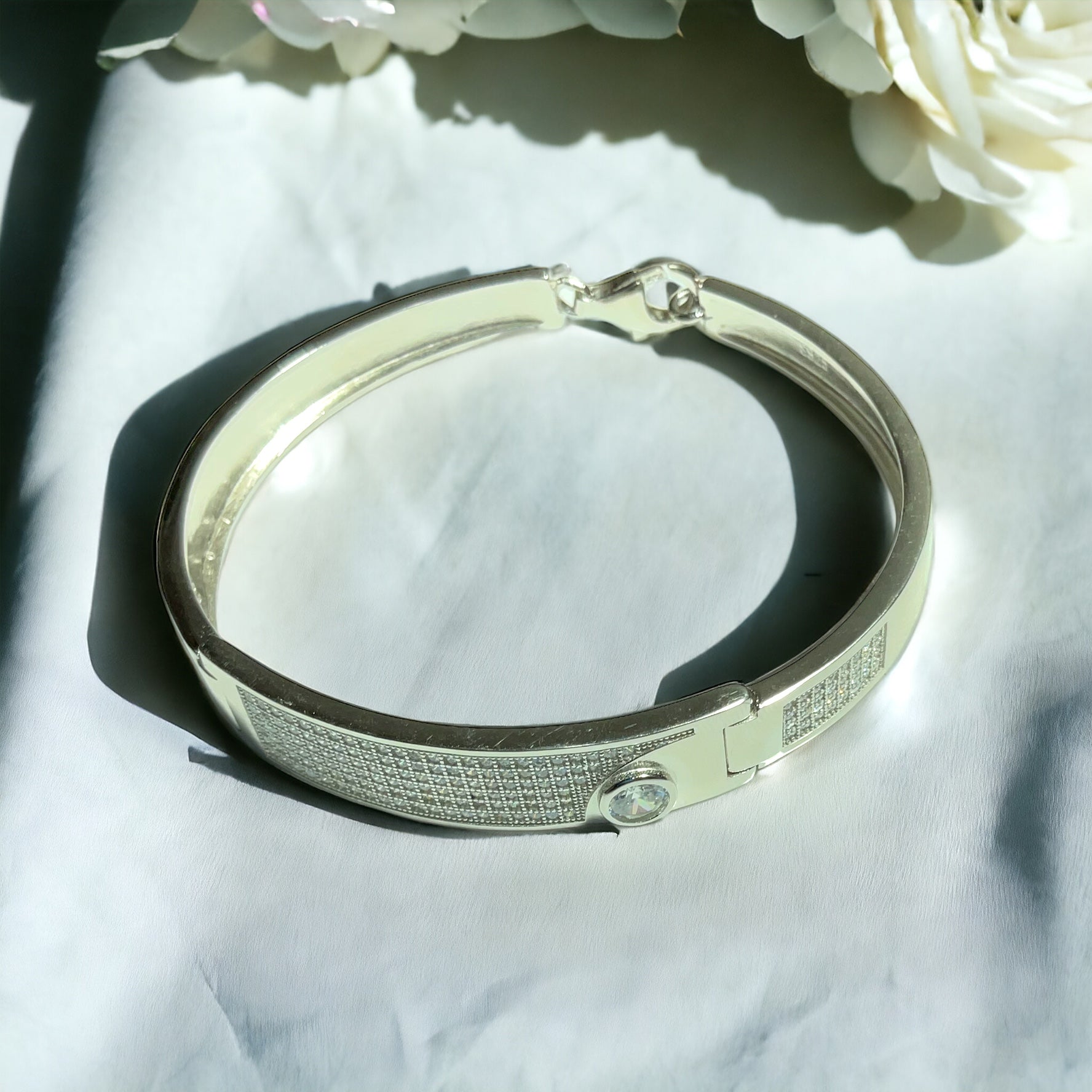 a close up of a bracelet on a table