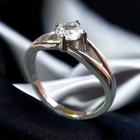 a close up of a ring with a diamond