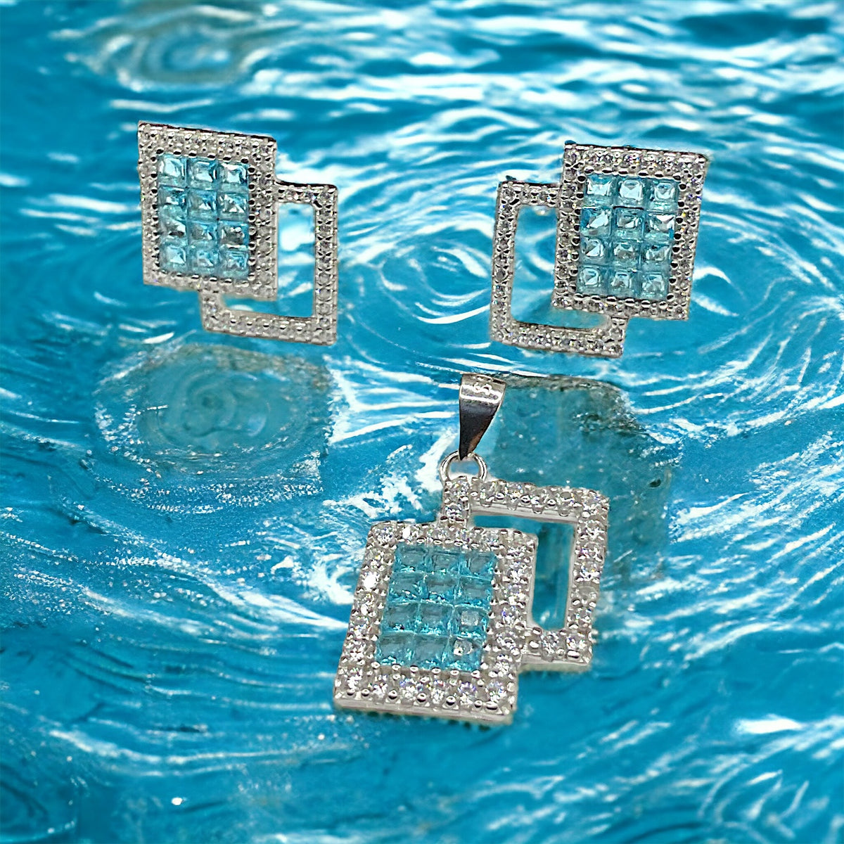 a group of square shaped diamonds floating in a pool of water