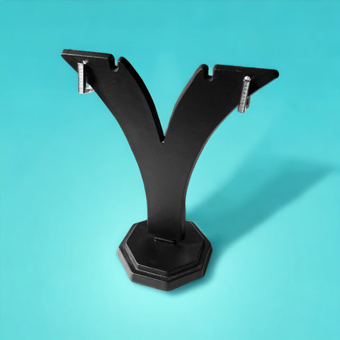 a pair of black metal brackets on a blue background