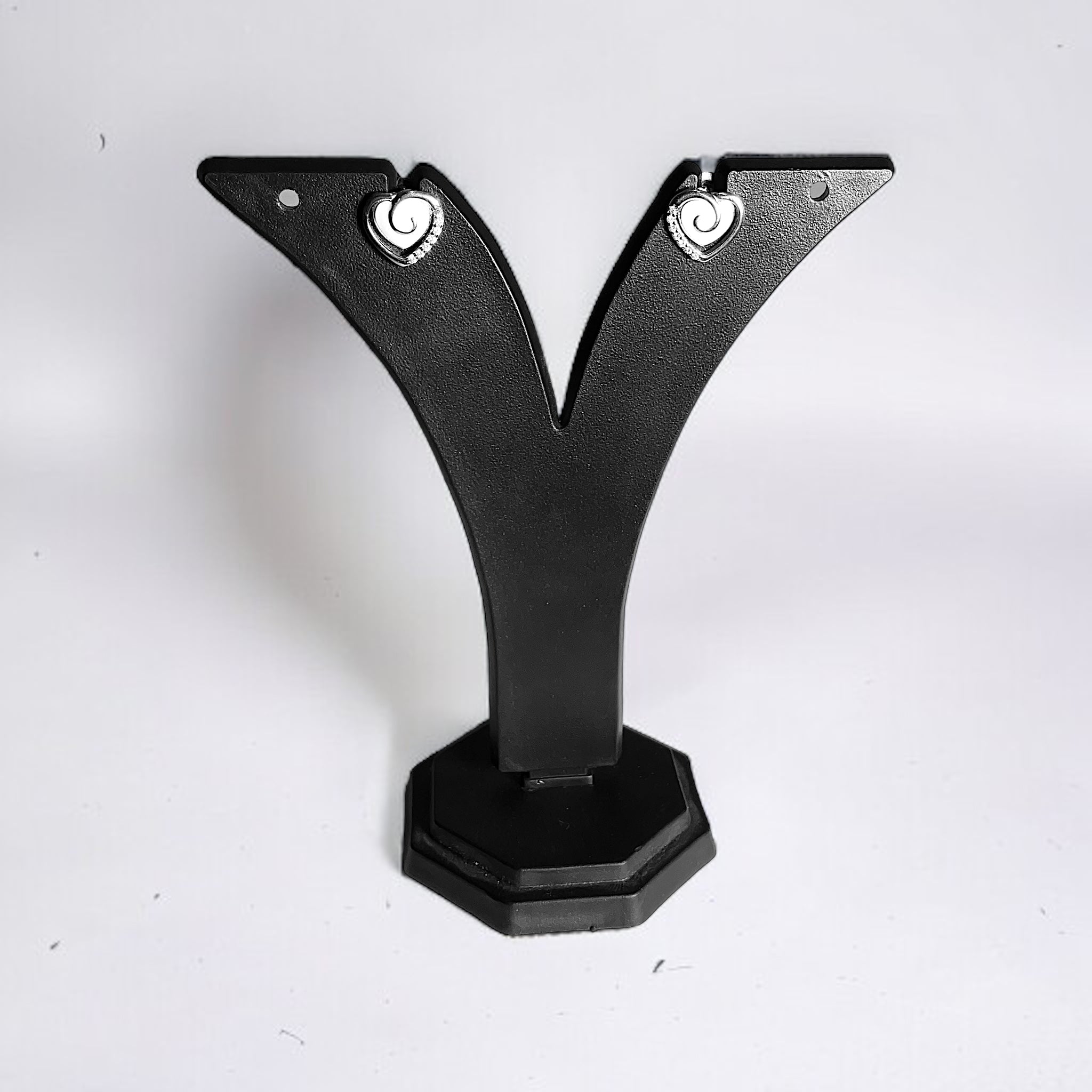 a pair of black metal brackets on a white background