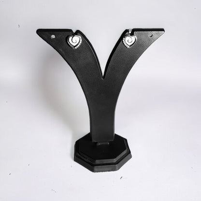 a pair of black metal brackets on a white background