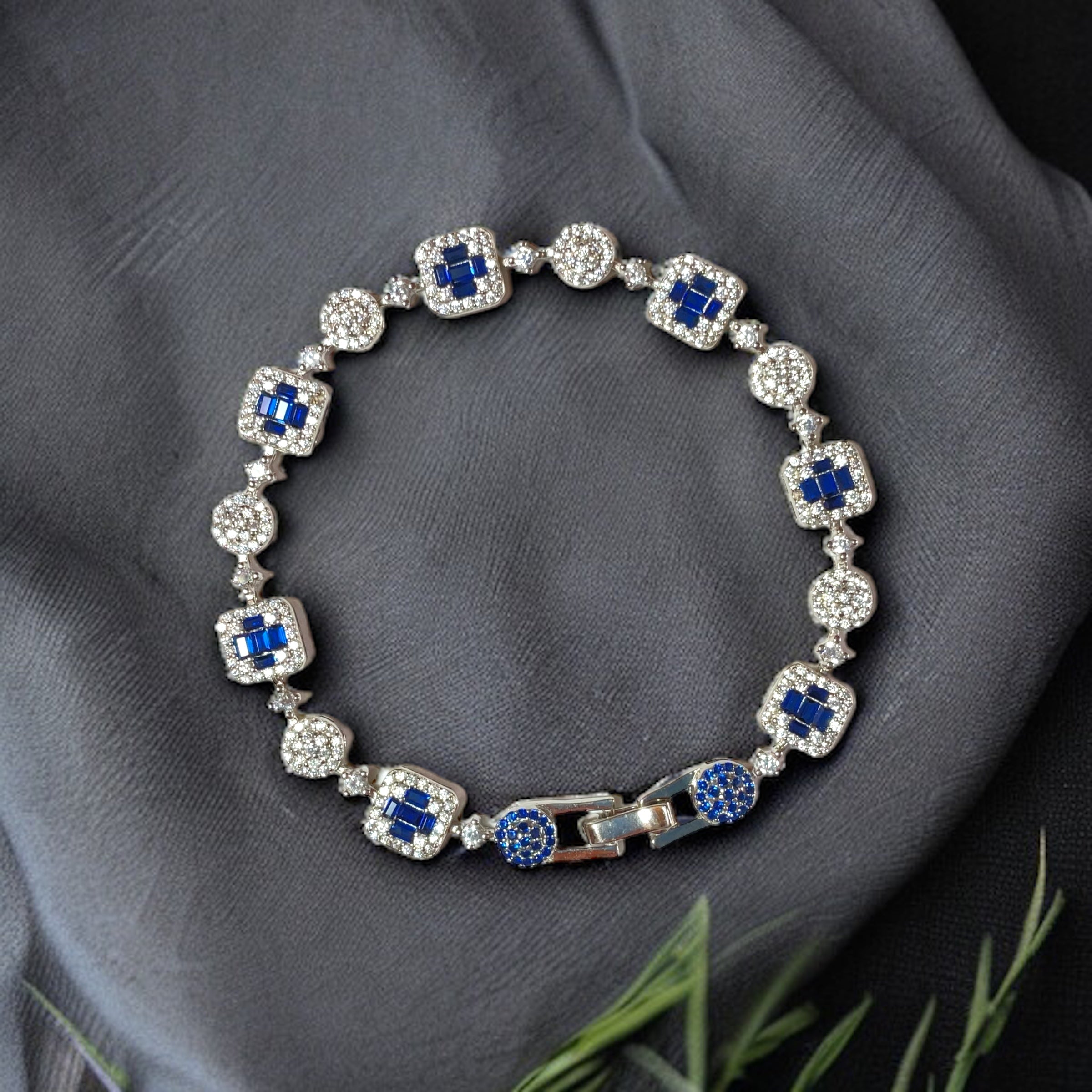 a bracelet with blue and white stones on it