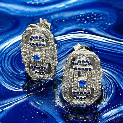 a pair of blue and white diamond earrings