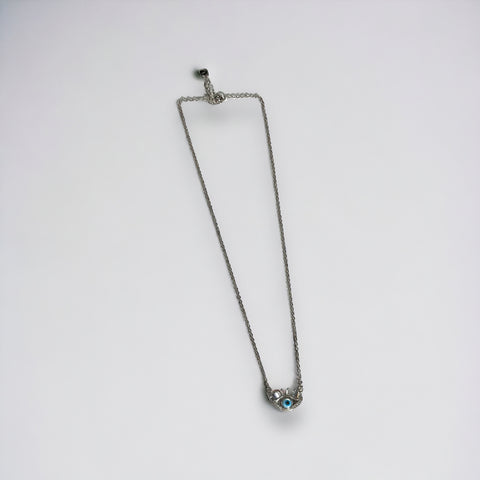 a necklace with a blue stone on a chain