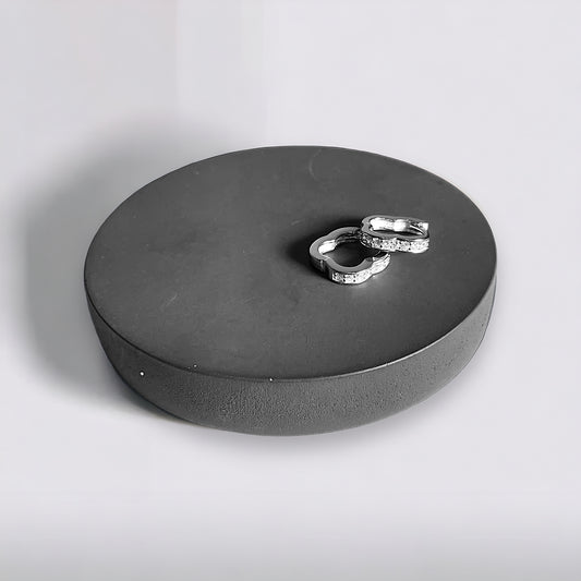 a couple of rings sitting on top of a black box