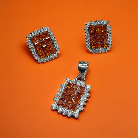 a couple of square shaped pendants on an orange background