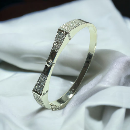 a close up of a ring on a white cloth