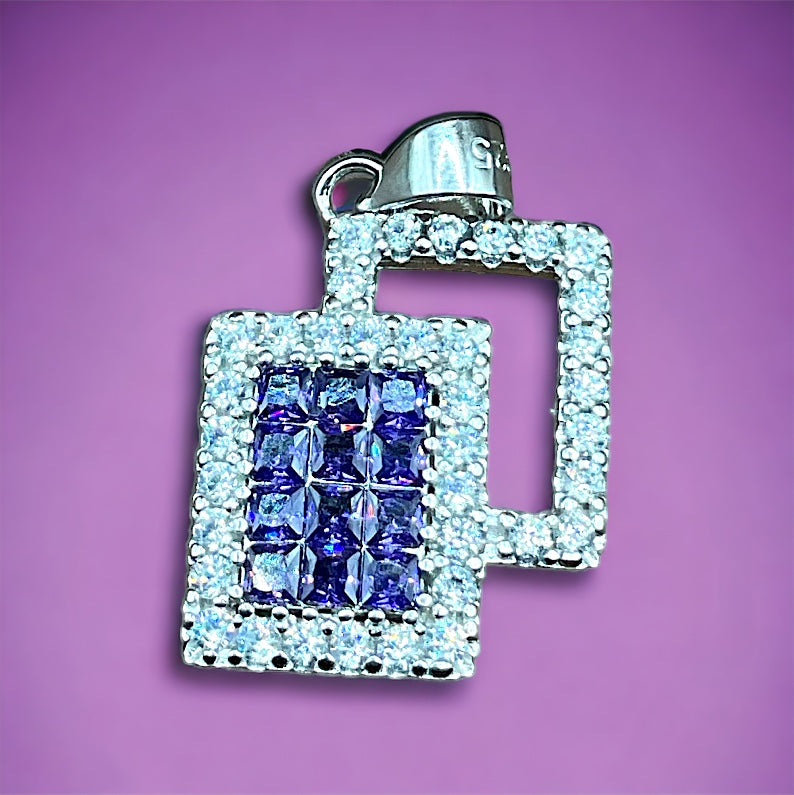 a square shaped pendant with blue and white stones