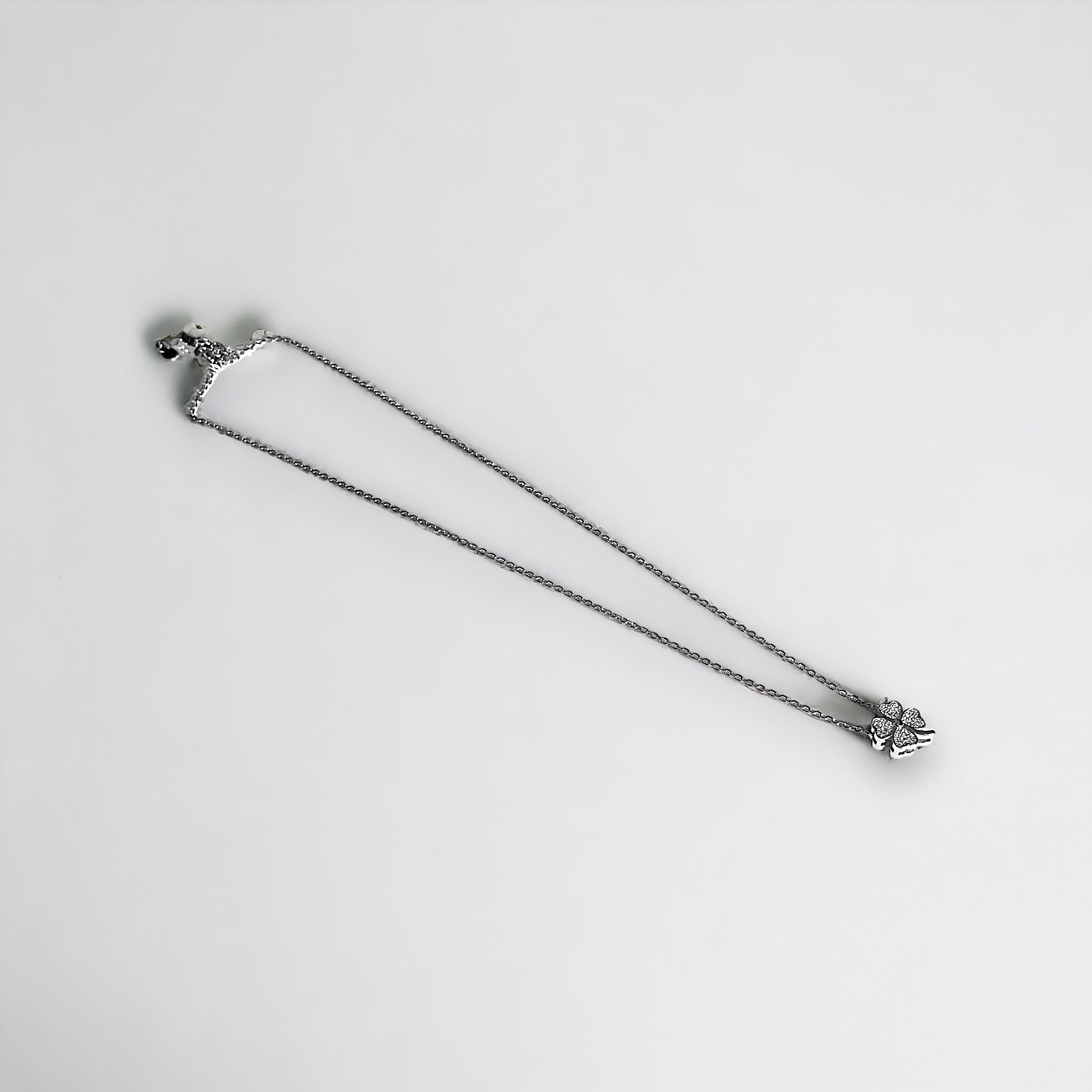a white background with a metal object on it