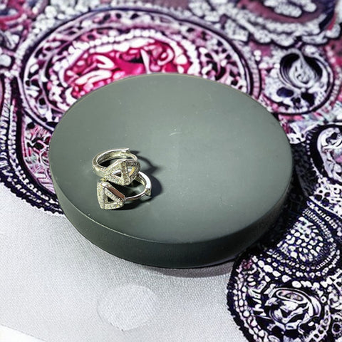 a ring sits on top of a round box