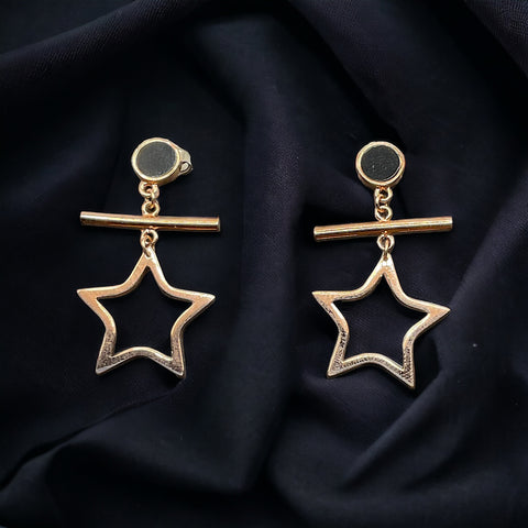 a pair of earrings with a star on it