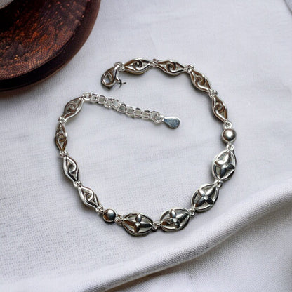 a close up of a bracelet on a table