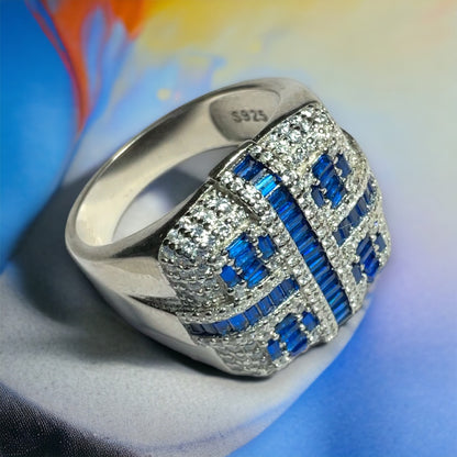 a ring with blue and white stones on it