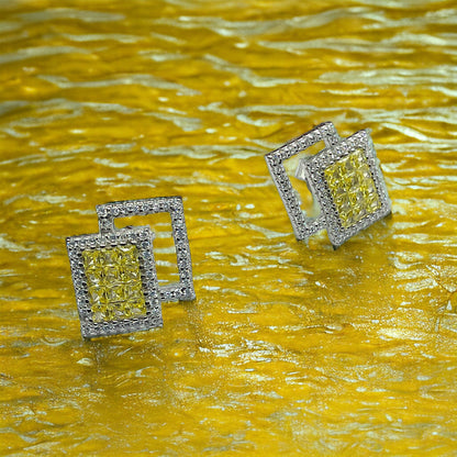 a pair of yellow and white diamond earrings