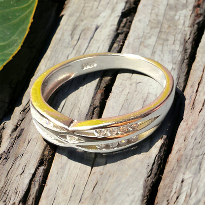 a close up of a ring on a wooden surface