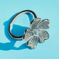 a silver ring with a flower on it