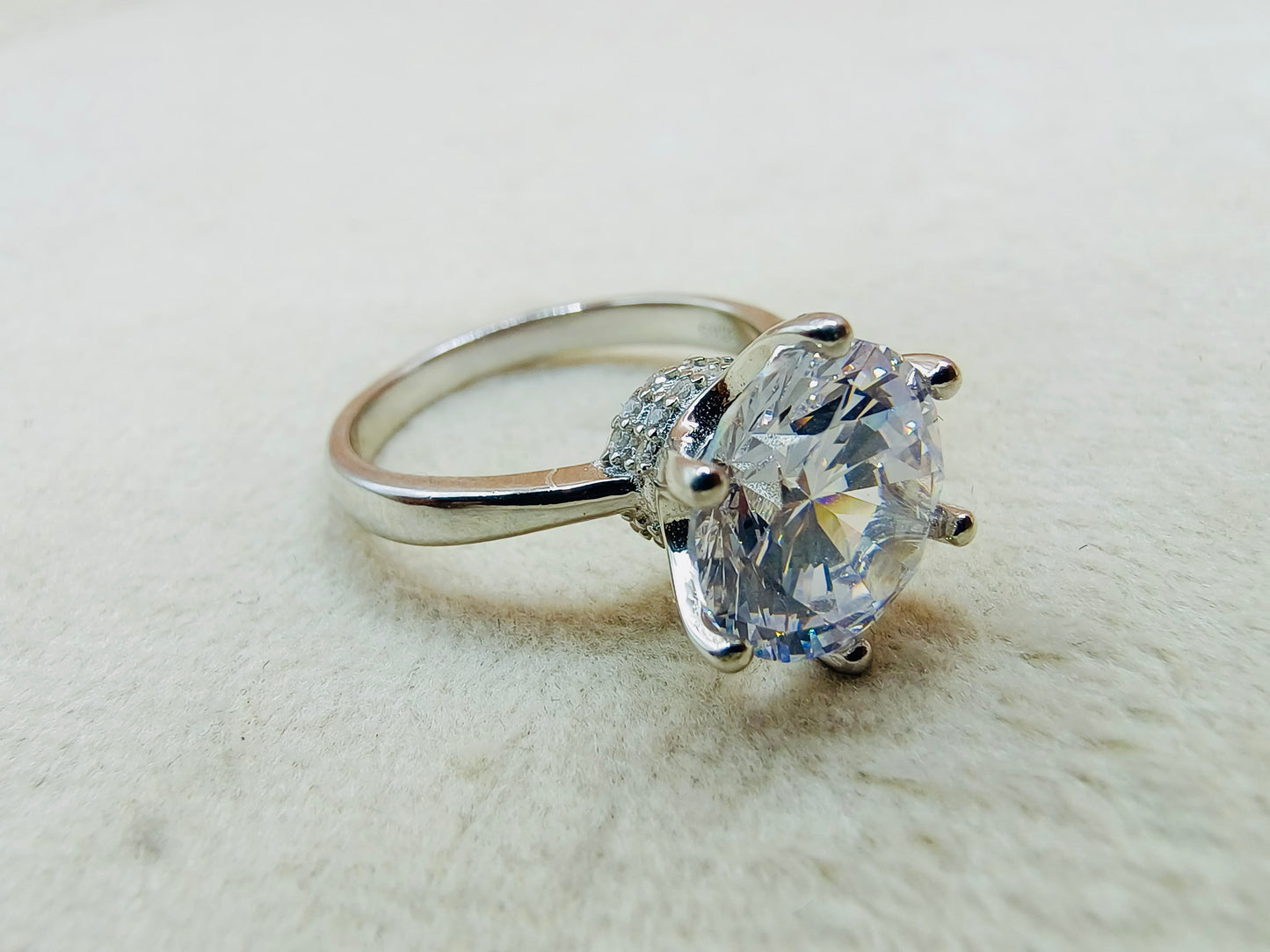 a ring with a large diamond on top of it