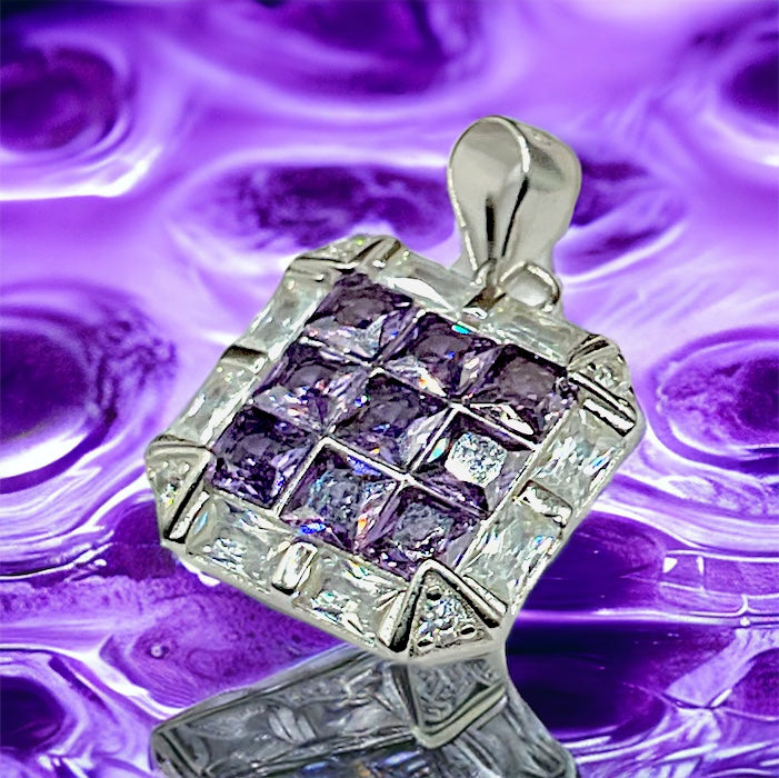 a purple and white diamond pendant on a purple background