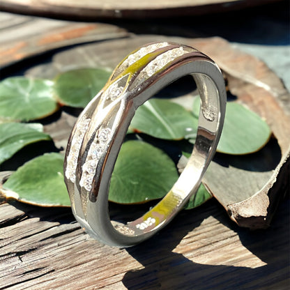 a couple of rings sitting on top of a wooden table