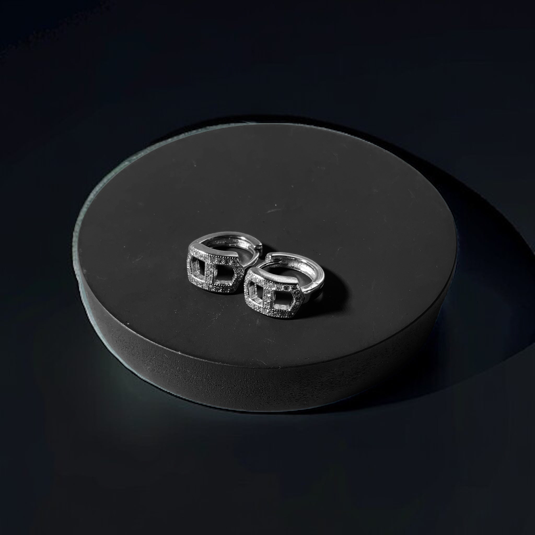 a couple of rings sitting on top of a black surface