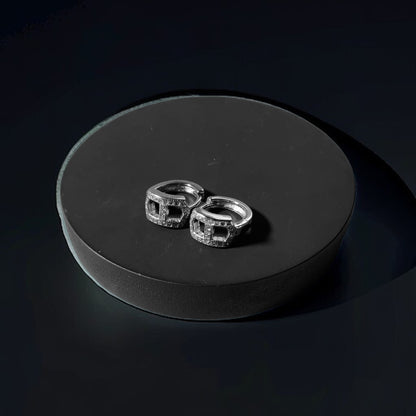 a couple of rings sitting on top of a black surface