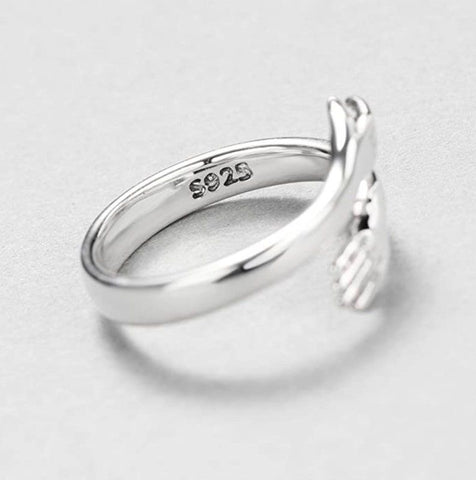 a close up of a ring on a white surface