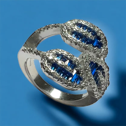 a blue and white diamond ring on a blue background