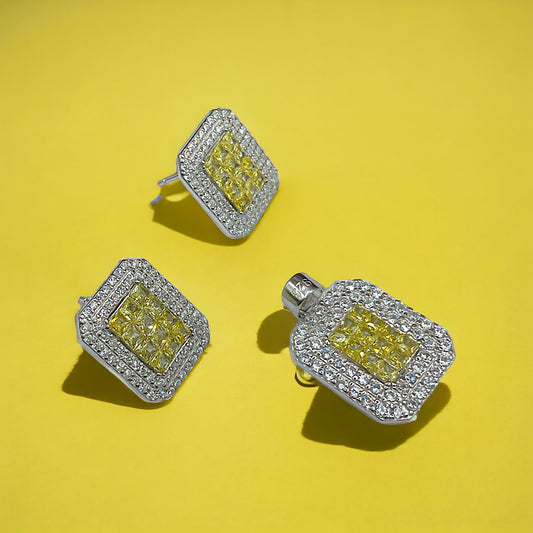 a pair of yellow and white diamond earrings