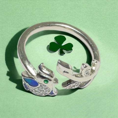 a close up of a ring with a shamrock on it