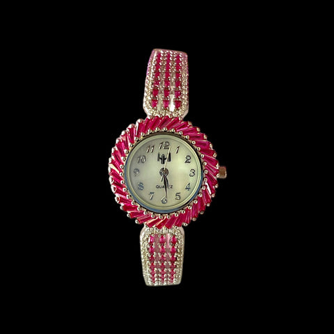 a red and white watch on a black background