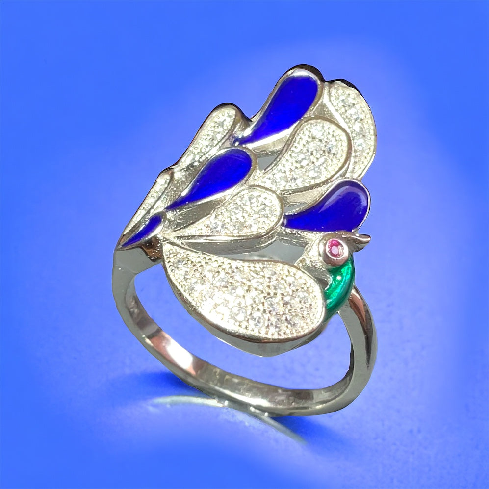 a ring with a blue and white flower on it