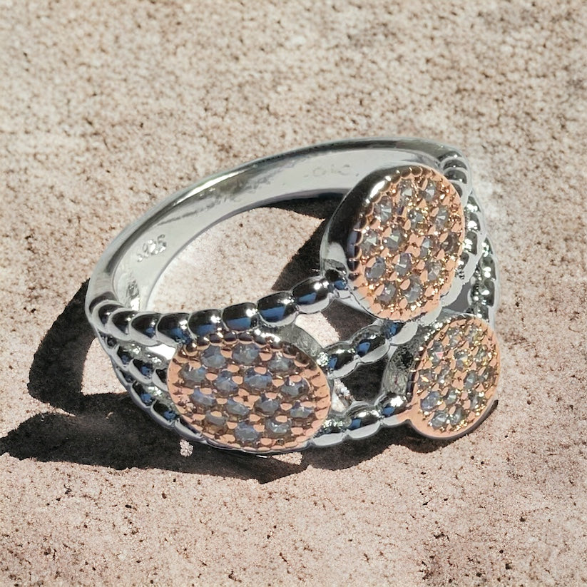 a close up of a ring on a sandy surface