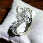 a diamond ring sitting on top of a white pillow