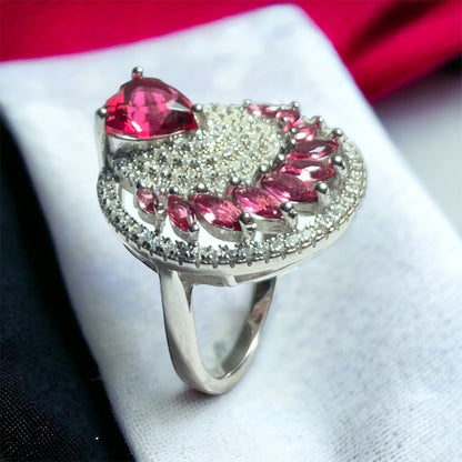 a ring with pink stones on a napkin