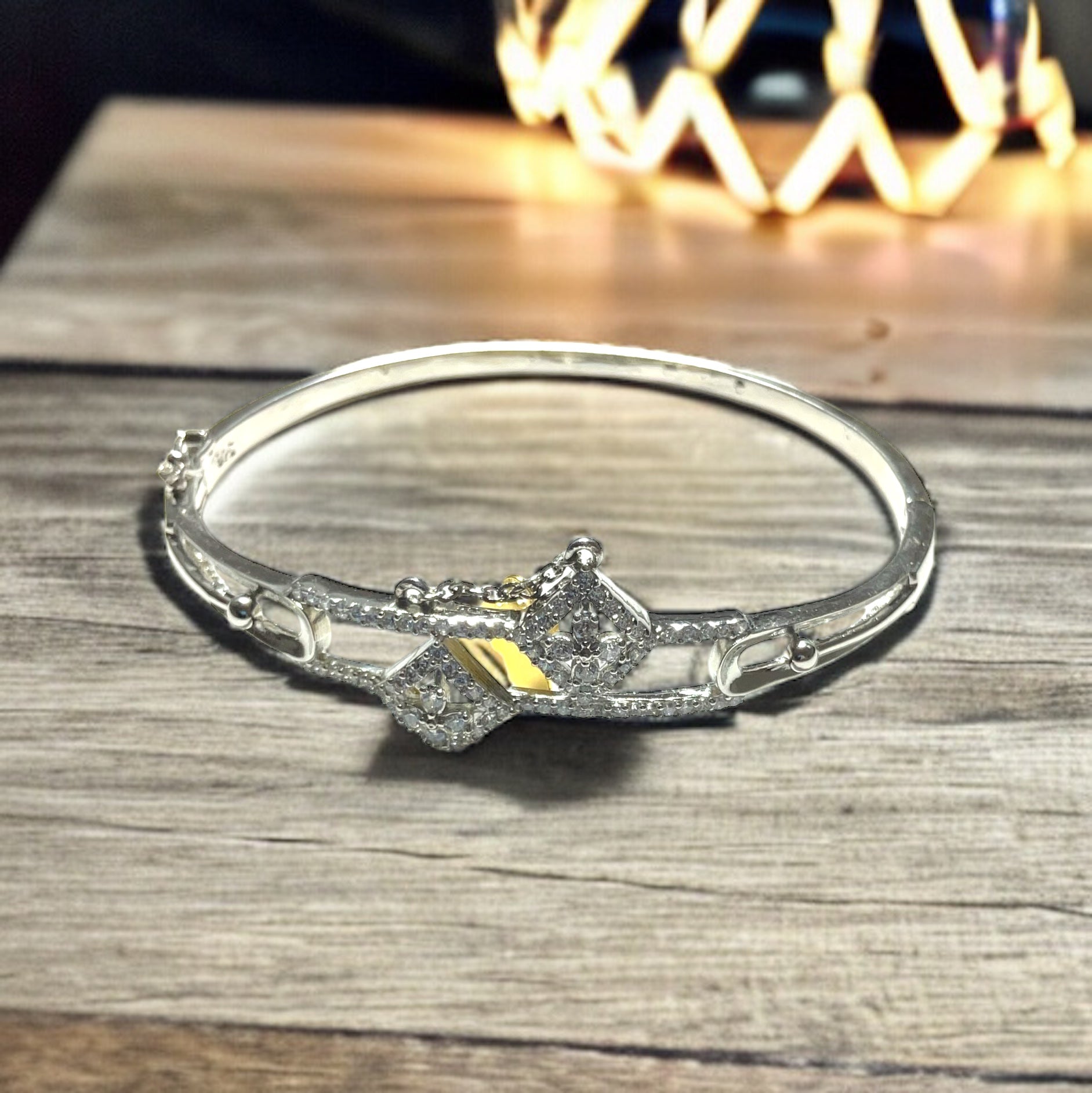 a close up of a bracelet on a table