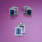 a pair of blue and white diamond earrings