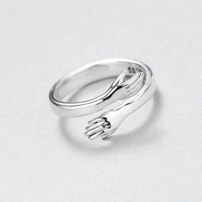 a close up of a silver ring on a white surface