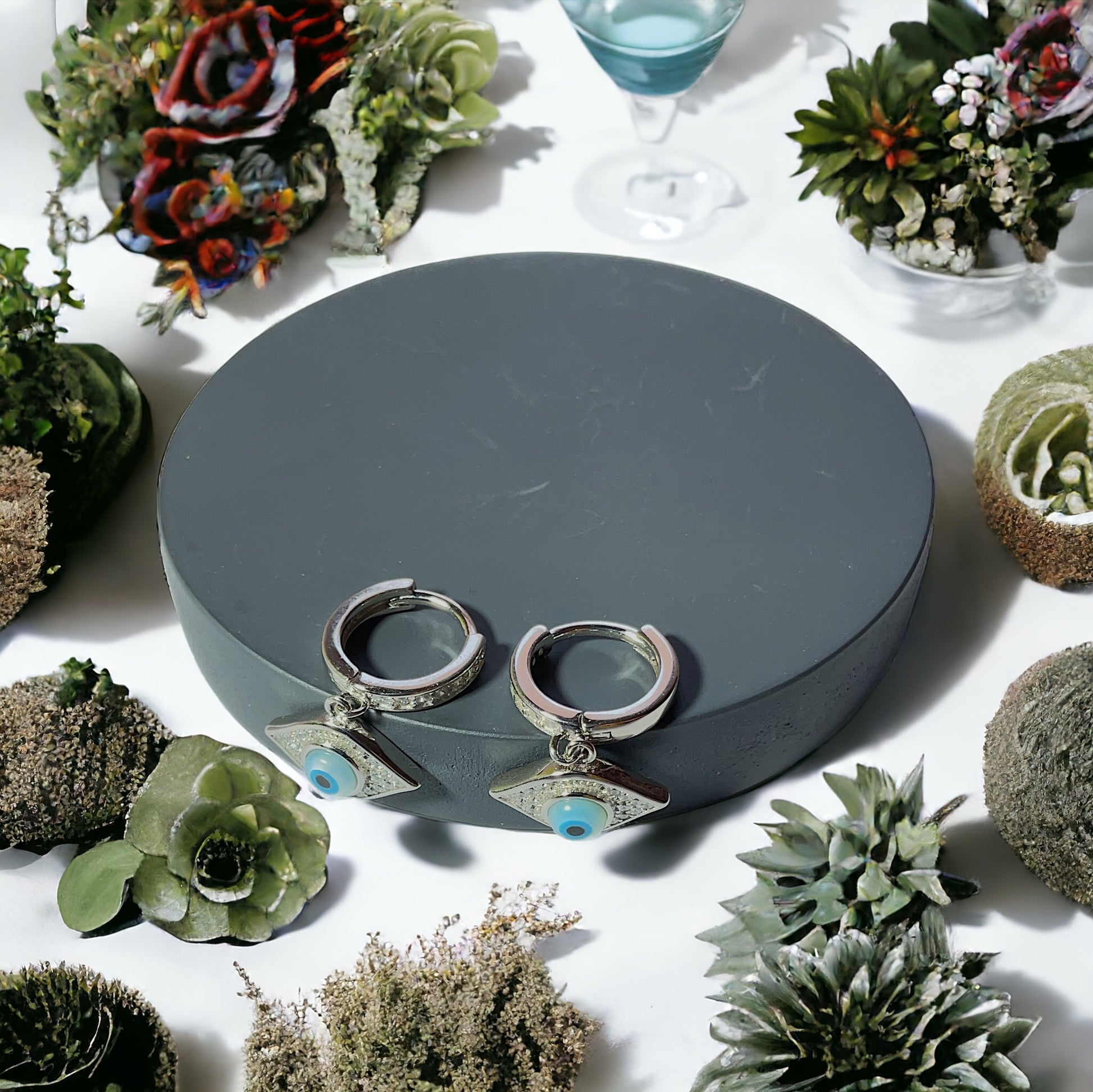 a couple of silver rings sitting on top of a table