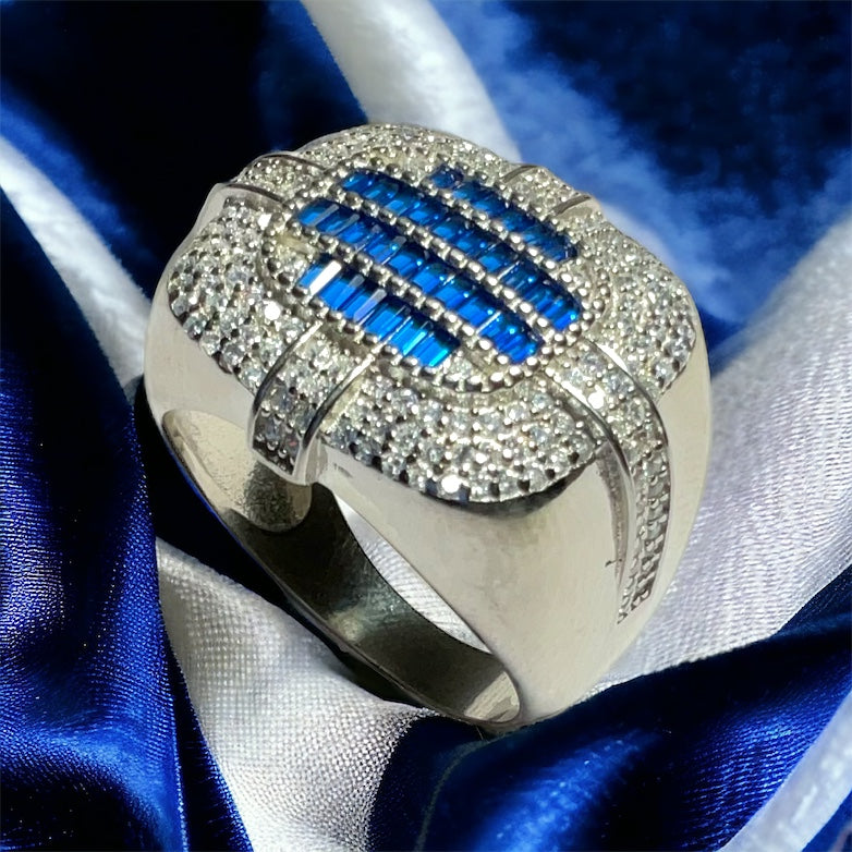 a ring with blue and white stones on it