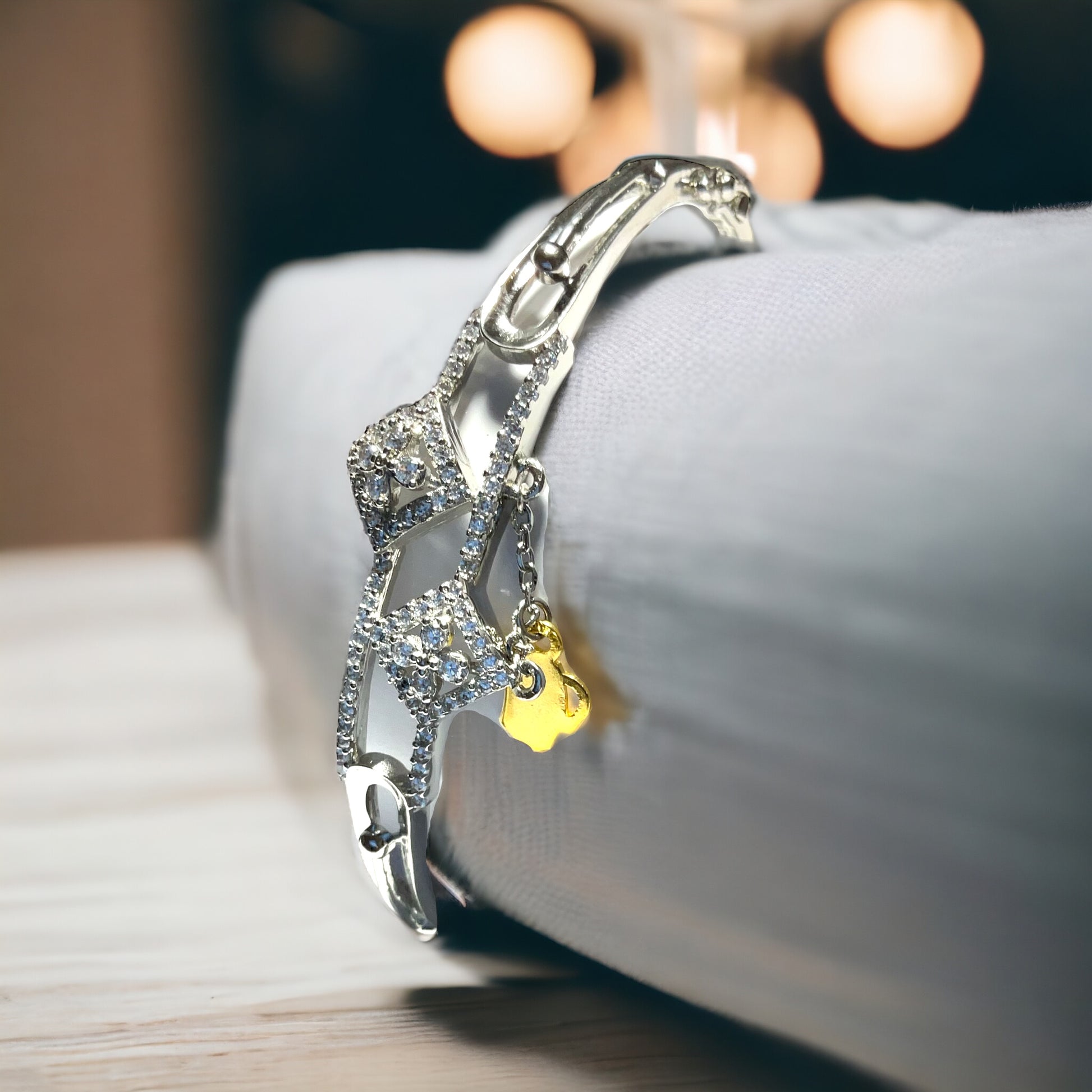 a close up of a bracelet on a bed